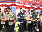 n3 Kapolda Sulteng Irjen Pol Agus Nugroho bersama Danrem 132 Tadulako Brigjen TNI Dody Triwinarto dan Wasops Lilin Itwasum Irjen Pol Yan Sultra, turun langsung patroli gabungan TNI, Polri pada Kamis malam, (28/12/2023). Foto Dok : Polda Sulteng